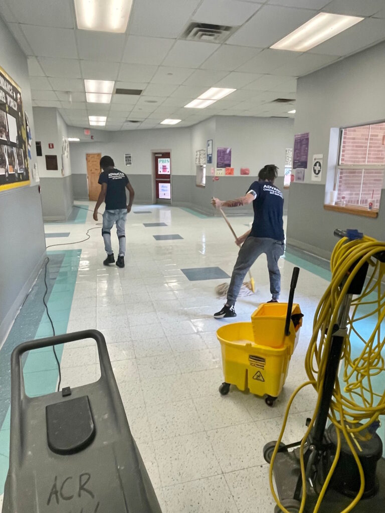 cleaning crew mopping and waxing school floor